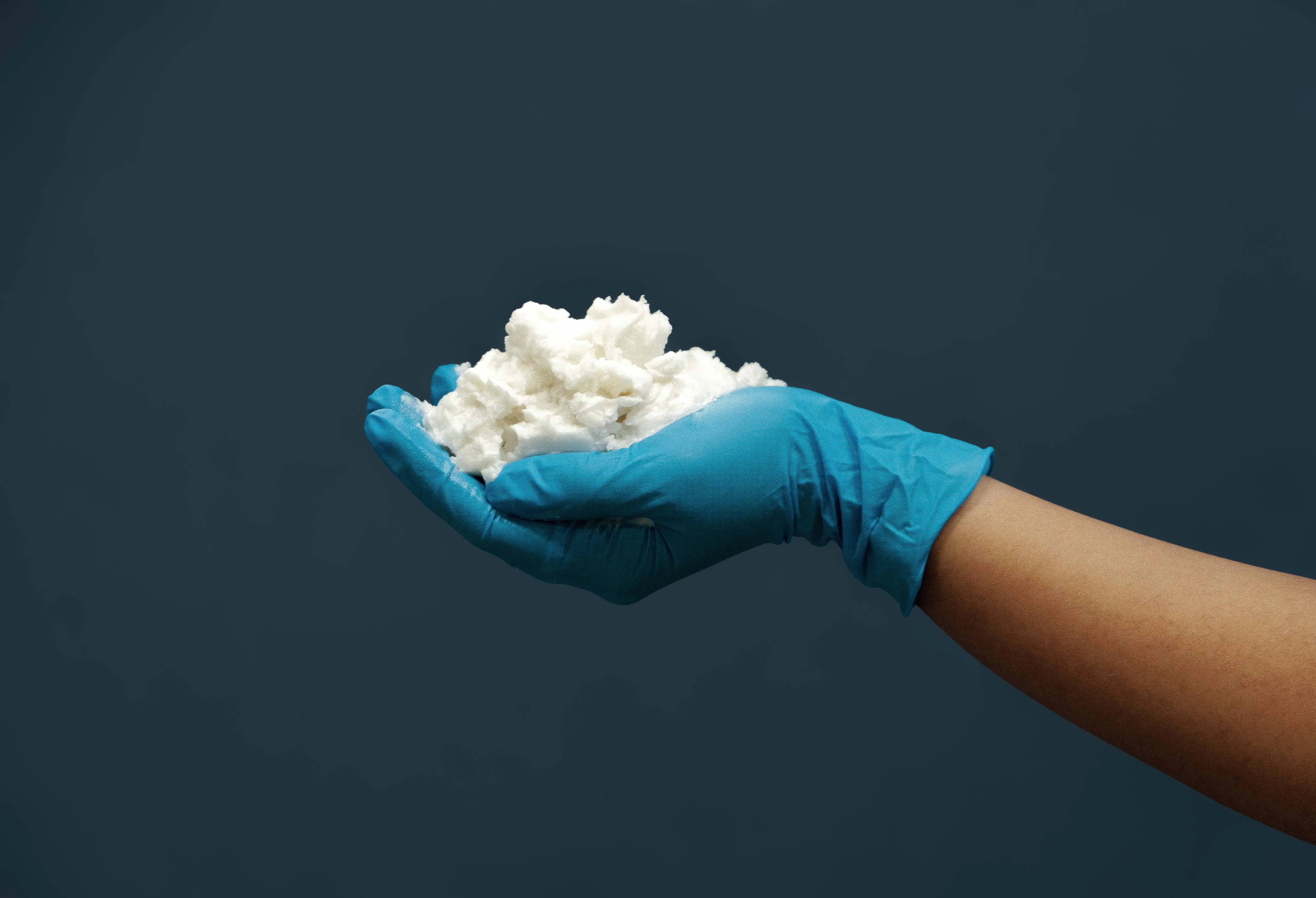 Hand filled with white wax